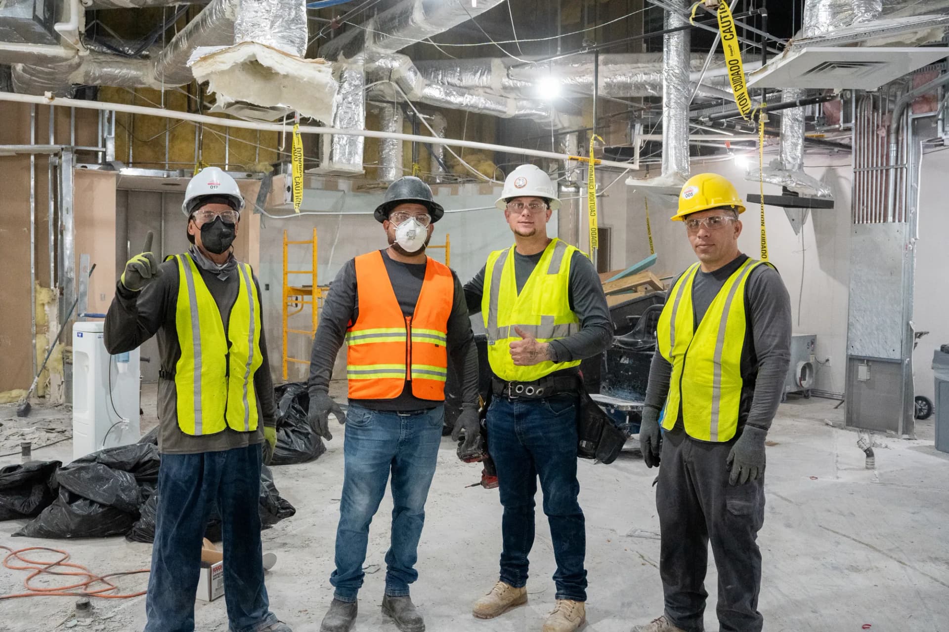 Four JZ Group field team members inside a commercial project