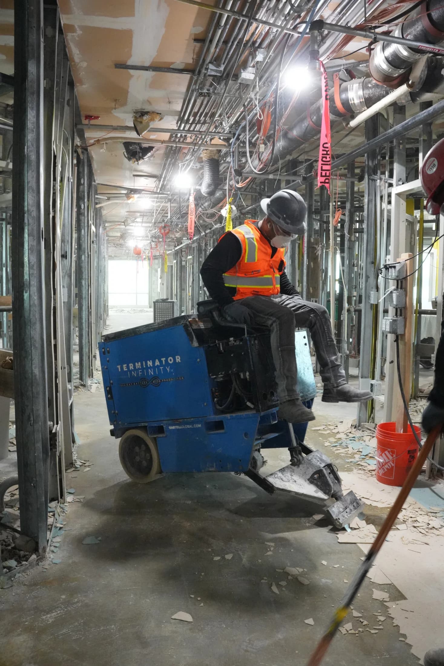 JZ operator using floor-removal equipment at the UHealth Tower penthouse jobsite